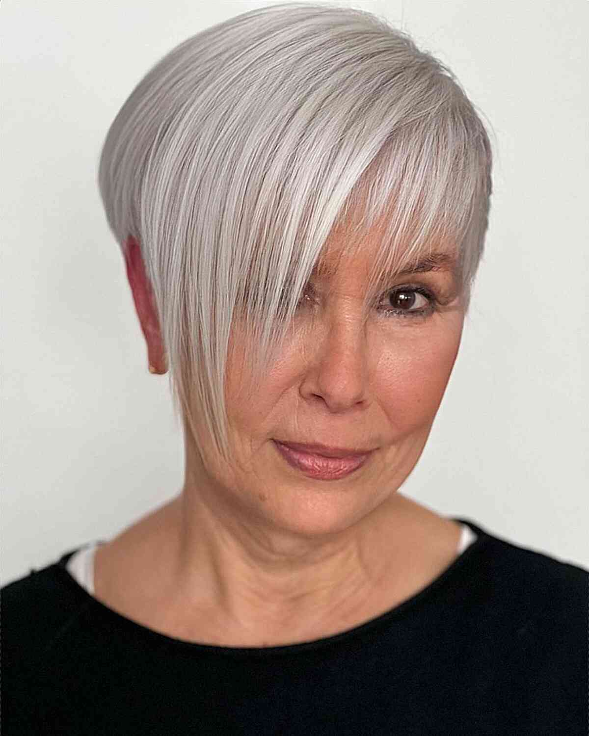 Asymmetric Pixie with Long Side Bangs for ladies in their 50s with straight fine hair