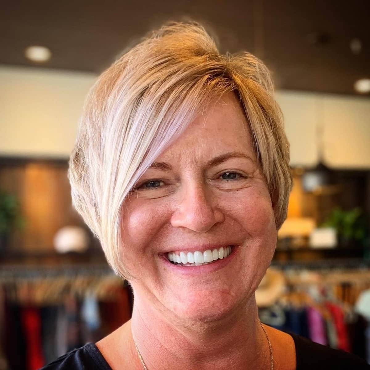 Asymmetrical haircut with layering for women in their 60s with fine Hair