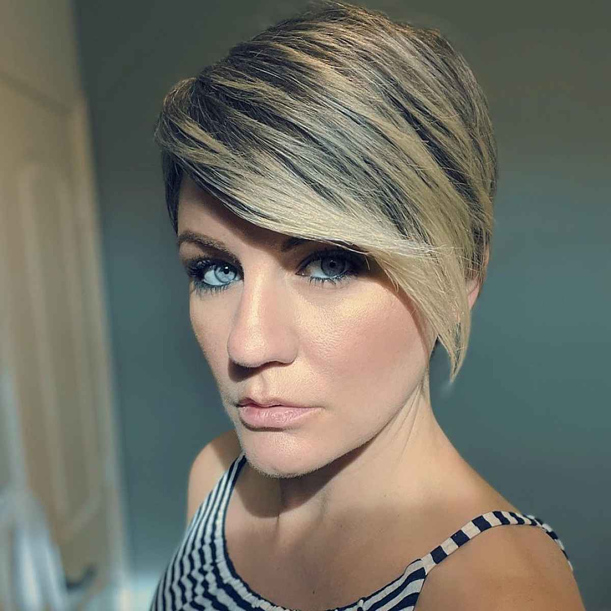 Asymmetrical pixie with a blonde balayage