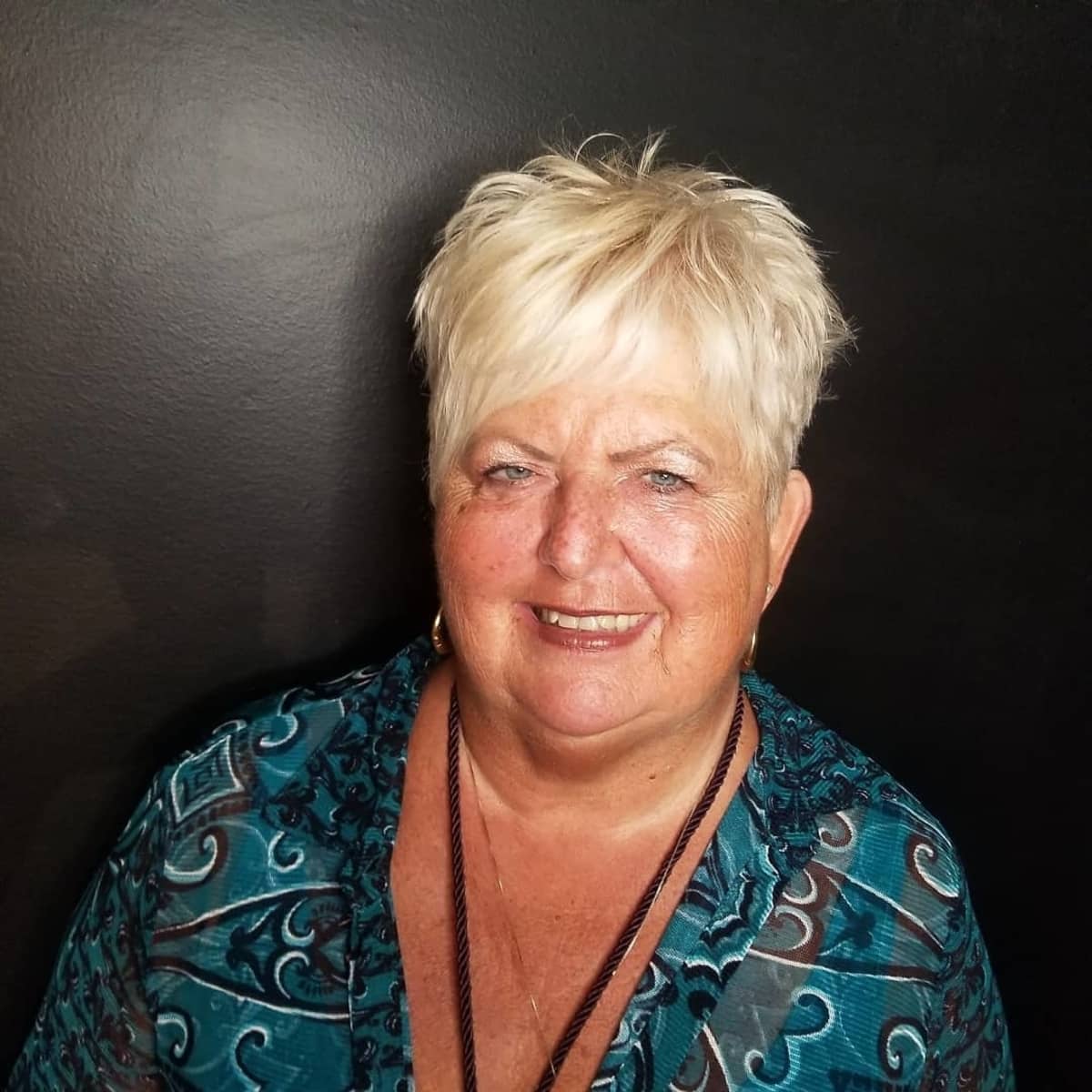 Asymmetrical short cut that's Messy and Spiky for women over 60 with Round Faces