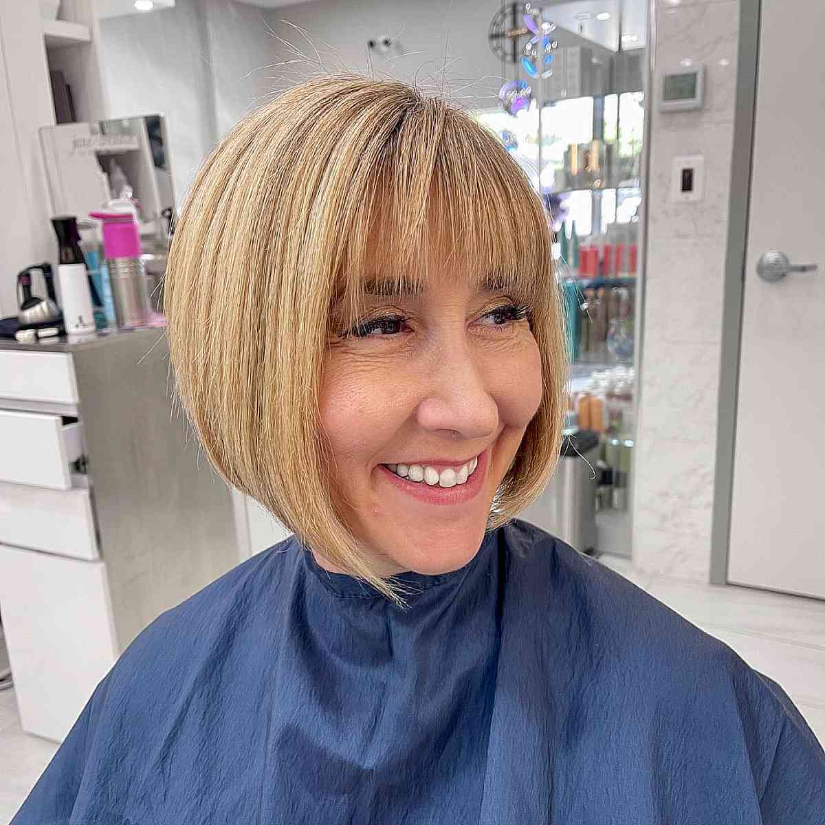 Blonde Asymmetric Bob with Wispy Bangs