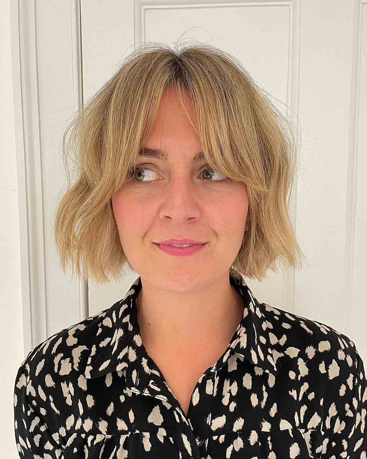 Blonde Blunt Cut Bob with Subtle Curtain Fringe