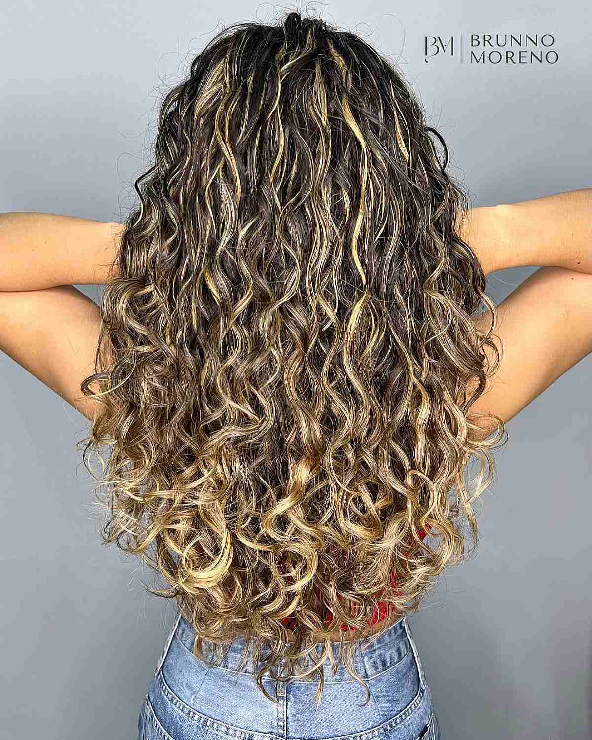 Bright Blonde Balayage Highlights on Long Dark Brown Curls