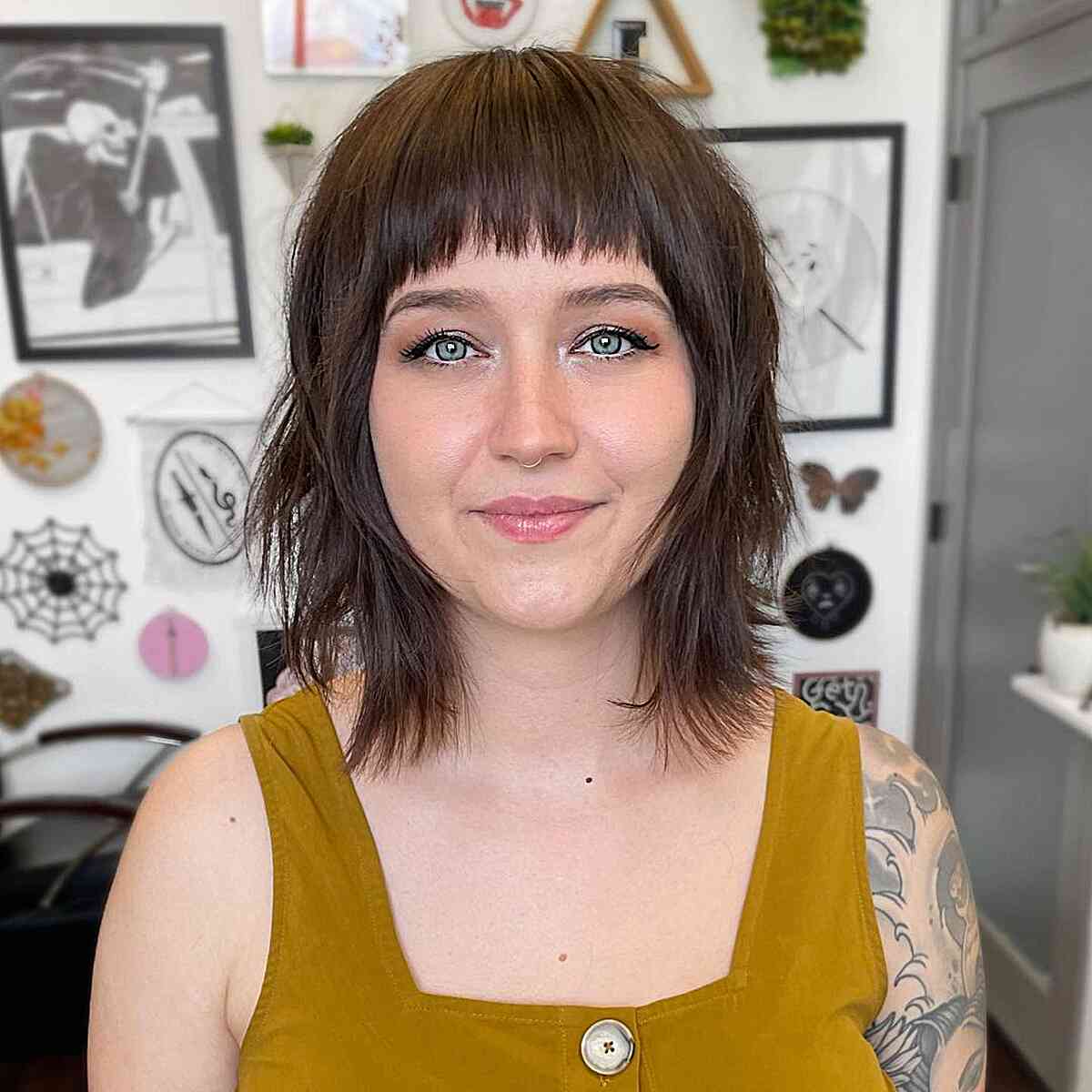 Brunette Long Bob with Bangs and Choppy Layers on Women with Rounder Faces