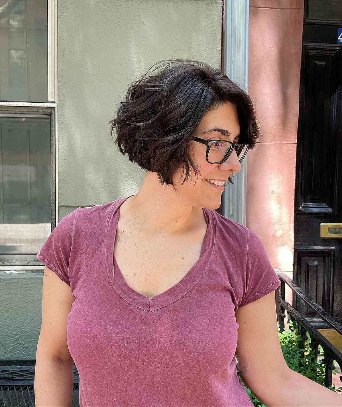 Edgy Short Bob with Razored Layers and Loose Waves at Jaw-Length