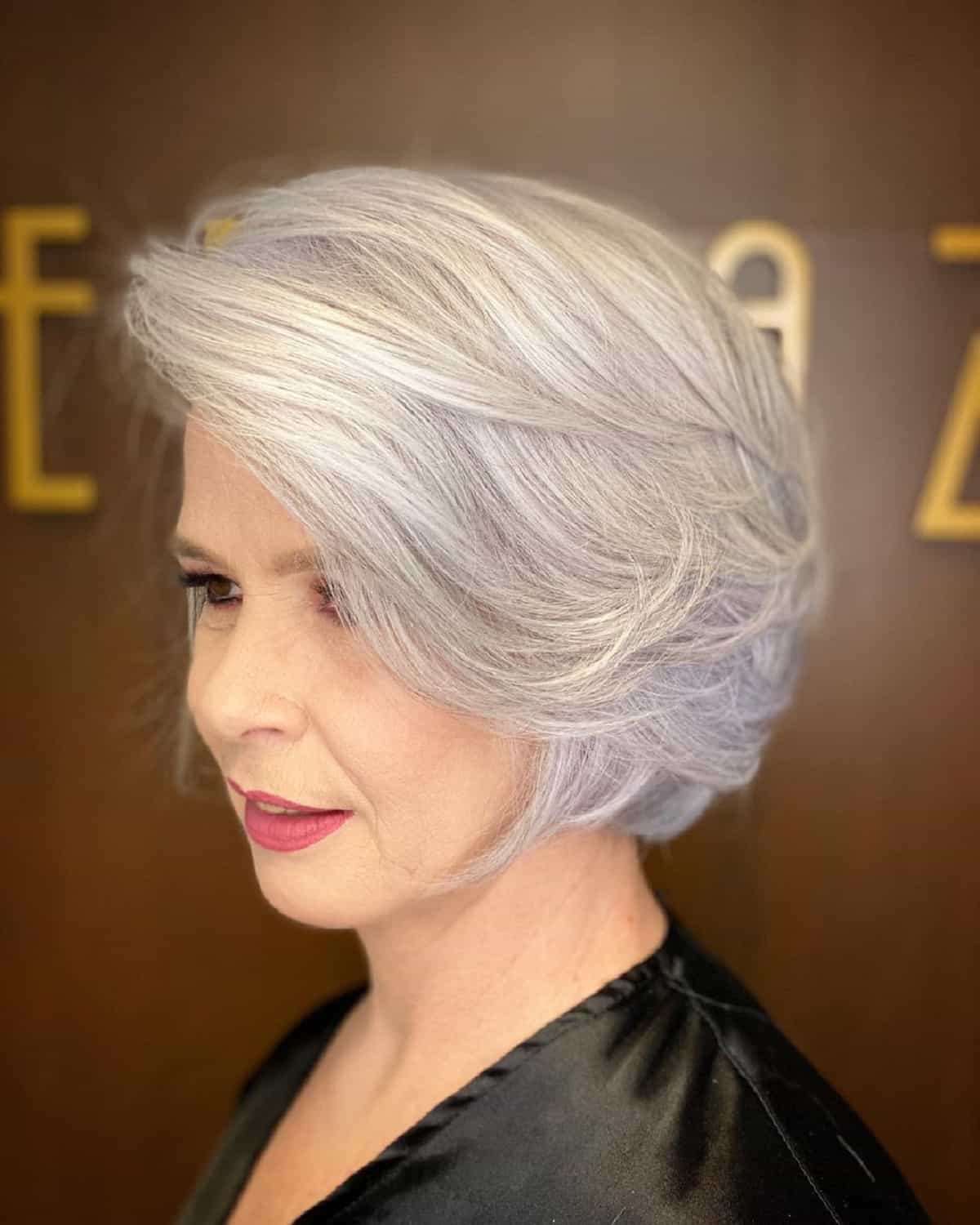 Feathered Bob with Side-Swept Bangs for a woman in her sixties