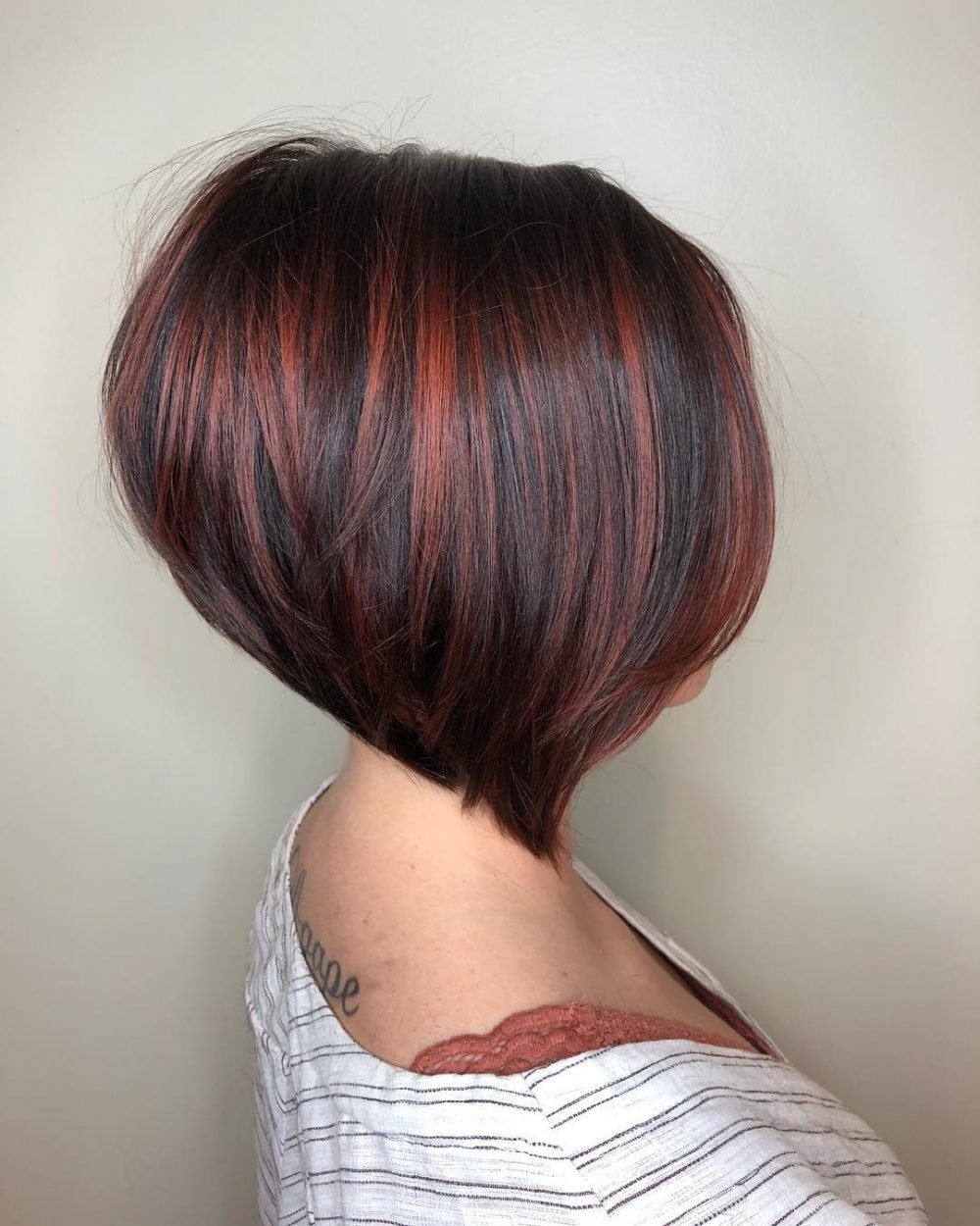 Stacked Inverted Bob with Vivid Red Highlights