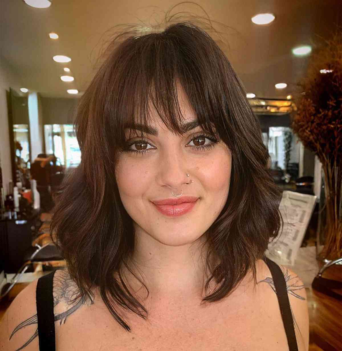 Long layered bob hairstyle with bangs