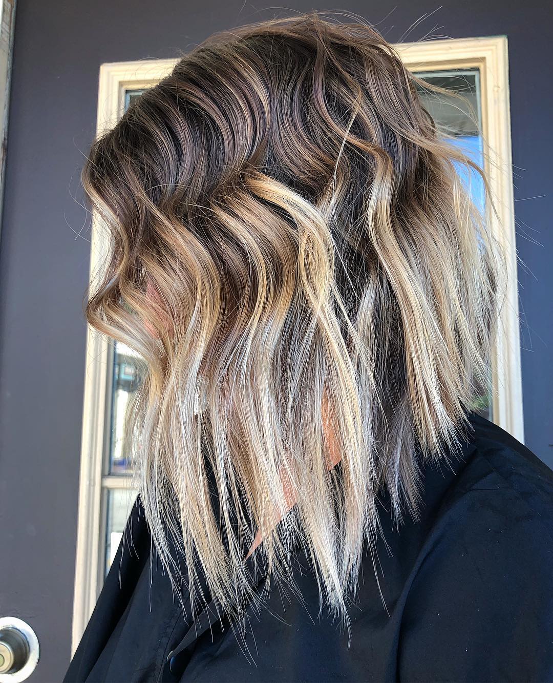 medium shaggy inverted bob for thin hair with blonde balayage