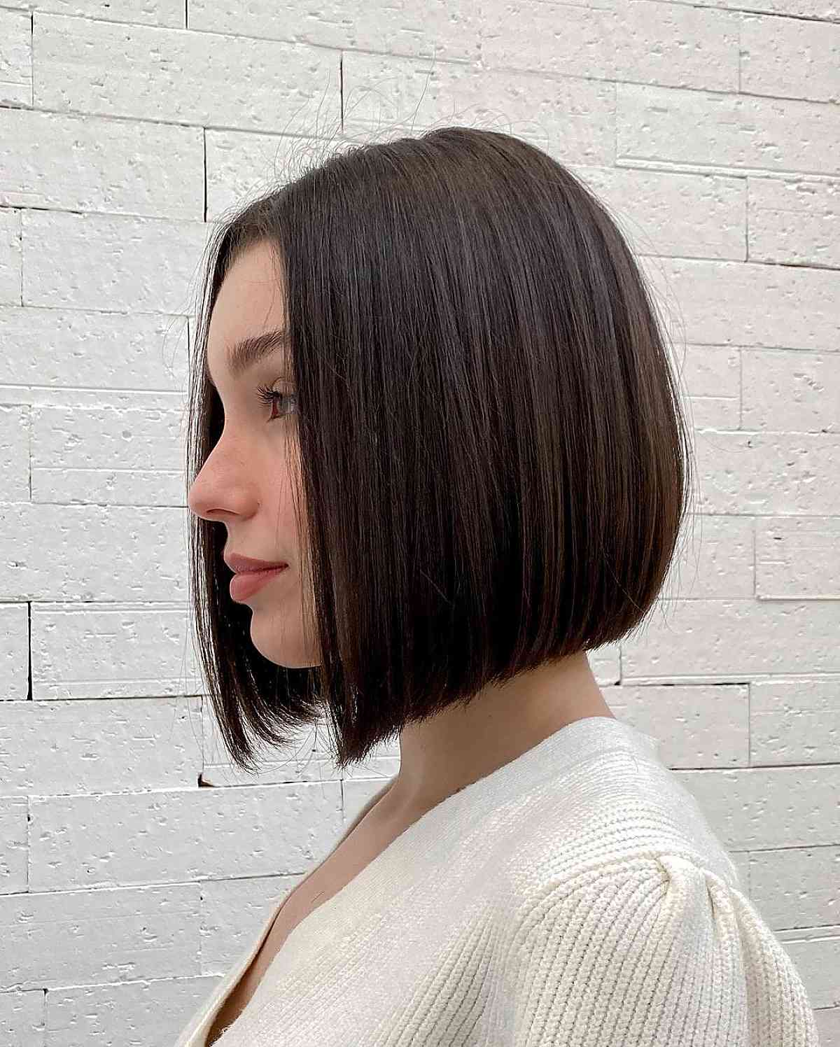 neck-length sleek bob with a middle part