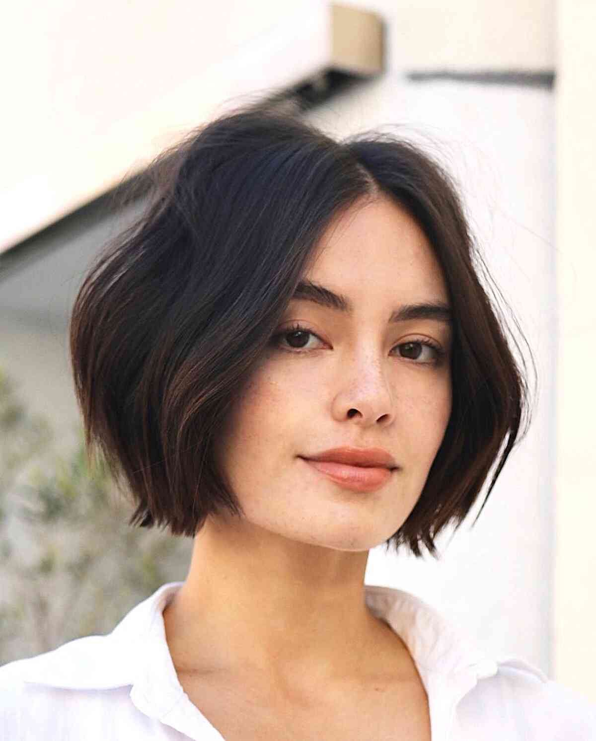 Short Layered One-Length Bob with a middle part and a slight bend in the hair