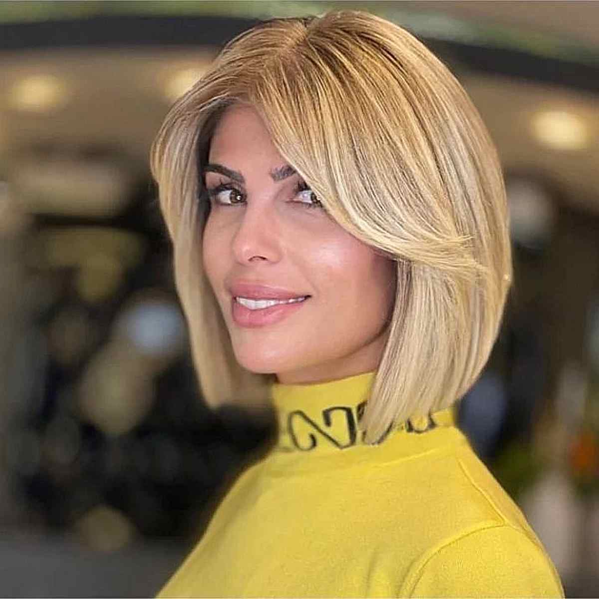 Soft Blonde Above-the-Shoulder Blunt Bob with Bangs