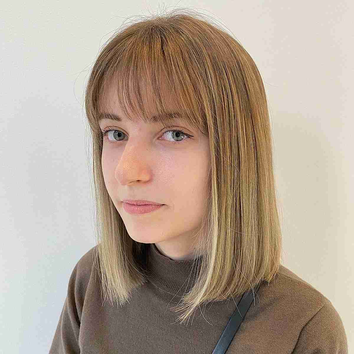 Straight Shoulder-Length Sliced Bob with Wispy Bangs